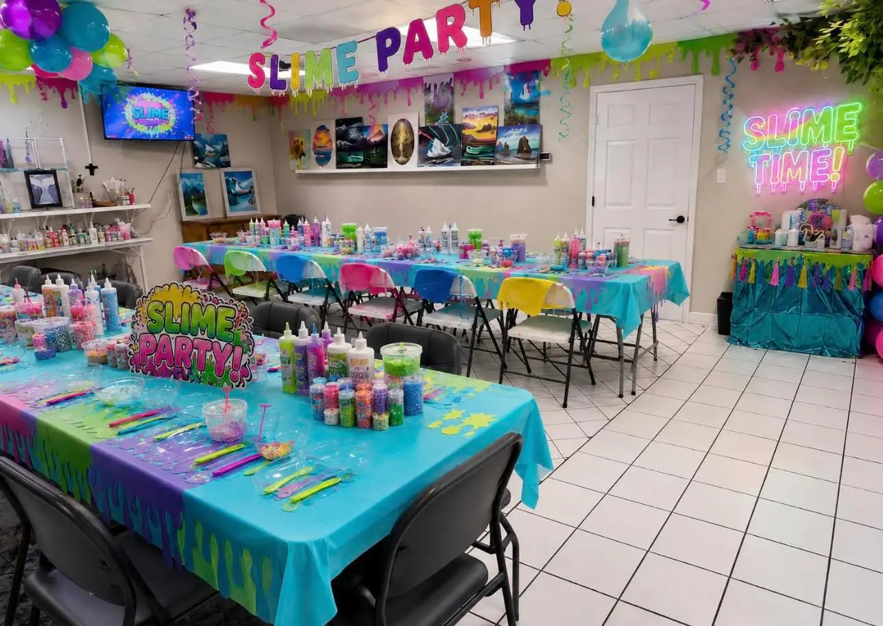 Colorful slime party tables arranged with slime supplies, mix-ins and tools